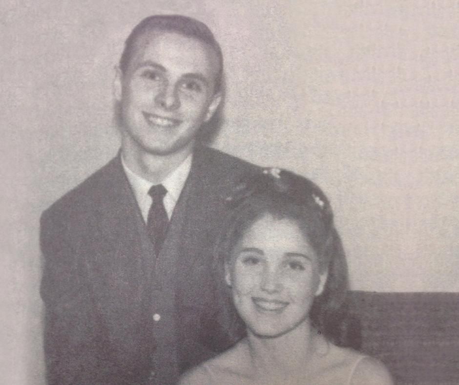 Dr. Mark and Allison Rutland  smiling, posed for a photo. Man in suit, woman in formal attire.