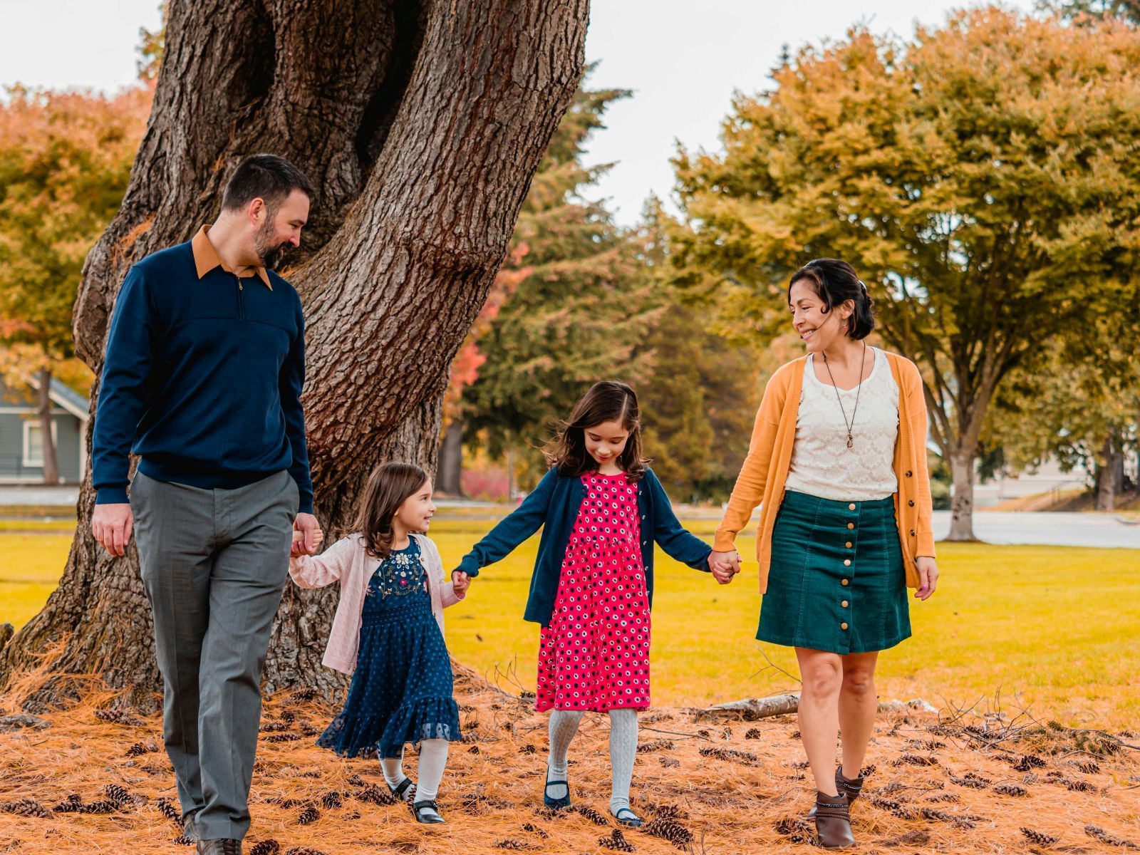 A happy family walking at the park together.