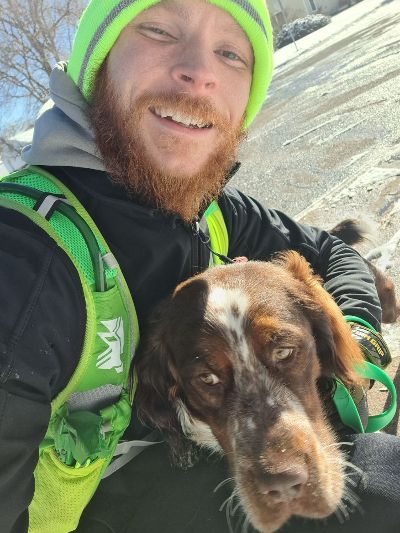 Image of Jake with a dog.