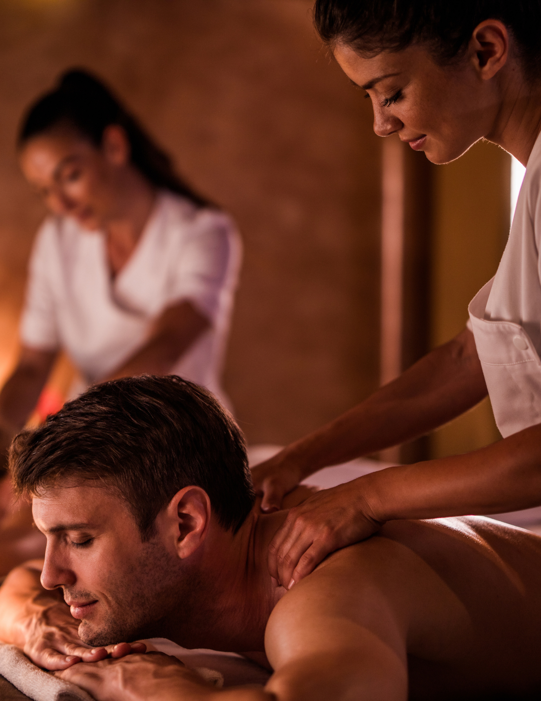Apply Now! A man is getting a massage from a woman in a spa.