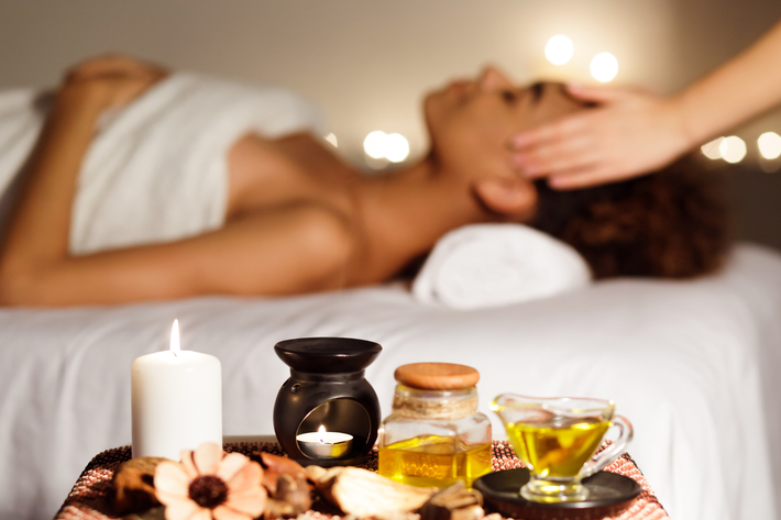 Learn More A woman is getting a massage at a spa.