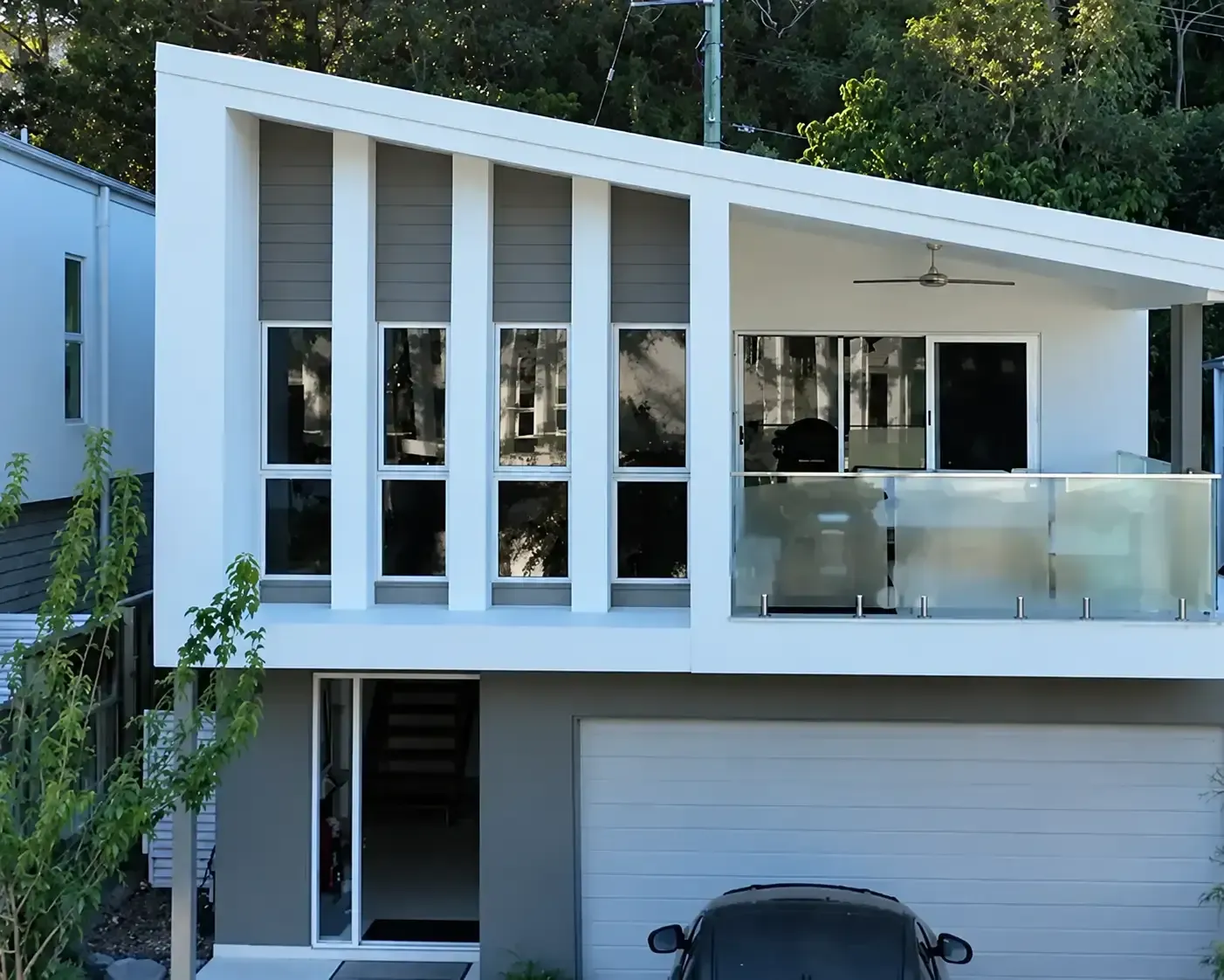 Modern white render and grey cladding home after soft wash house washing in The Gap, Brisbane