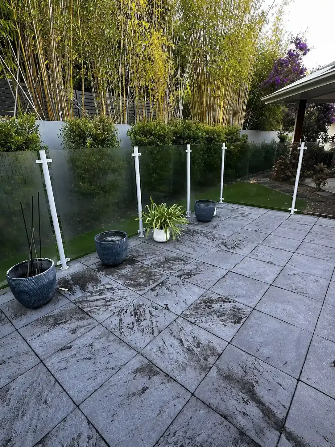 Mould-stained paved patio before paver cleaning in Holland Park, Brisbane