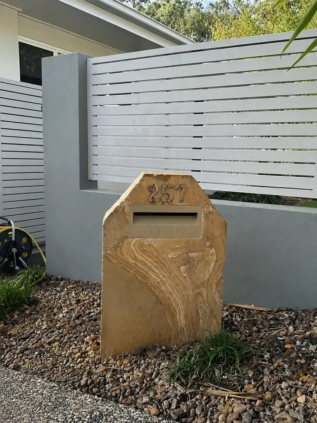 Sandstone letterbox after pressure cleaning in Carindale, Brisbane