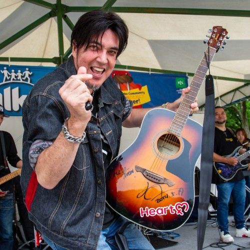 James Havens on stage with a guitar