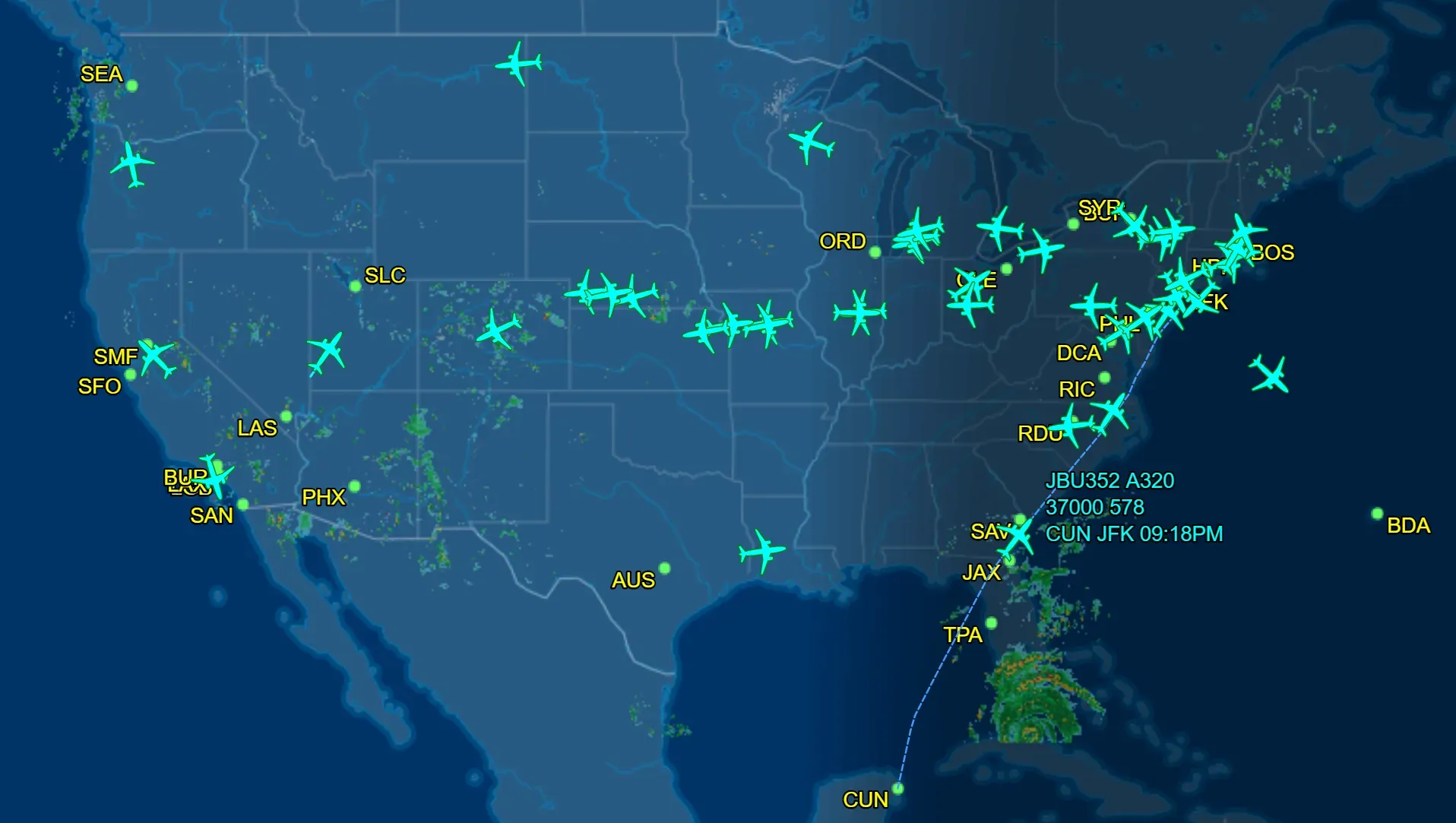 Map of the USA with many green airplane icons, indicating air traffic across the country and the Caribbean.