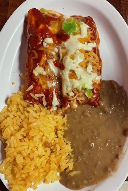 A plate of food with rice and beans on it