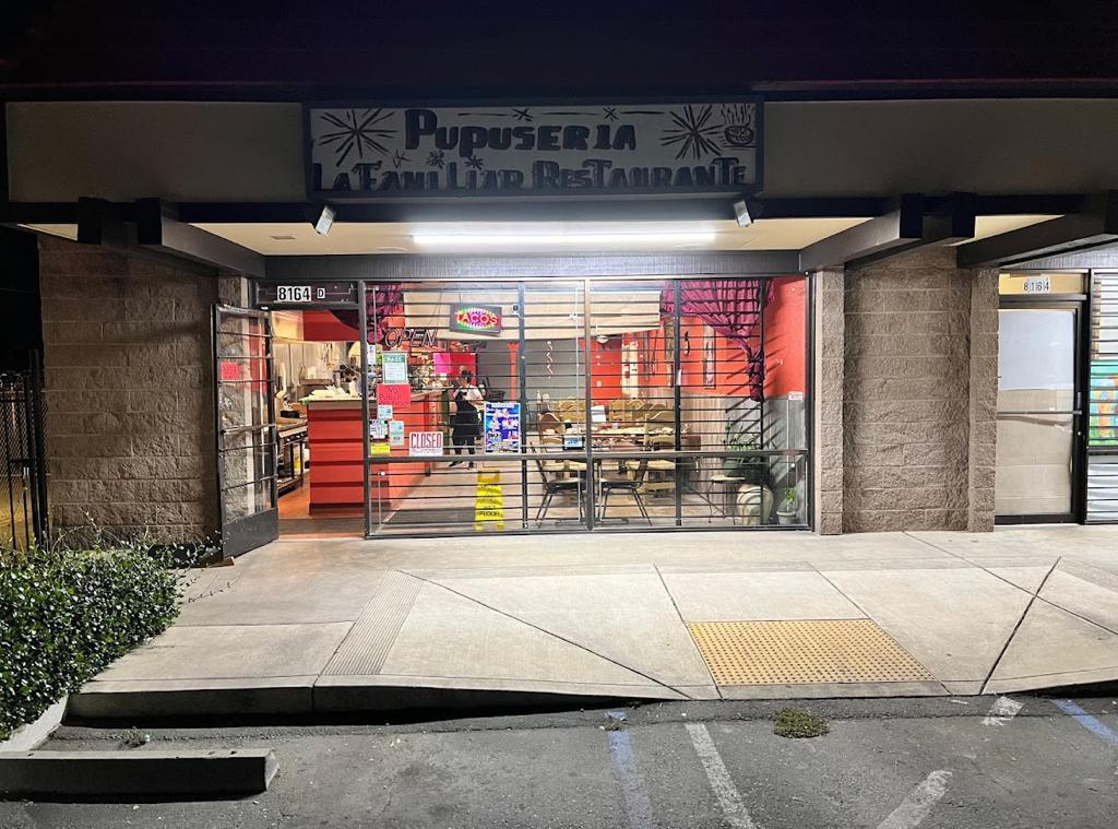 A store front with a sign that says pupuseria