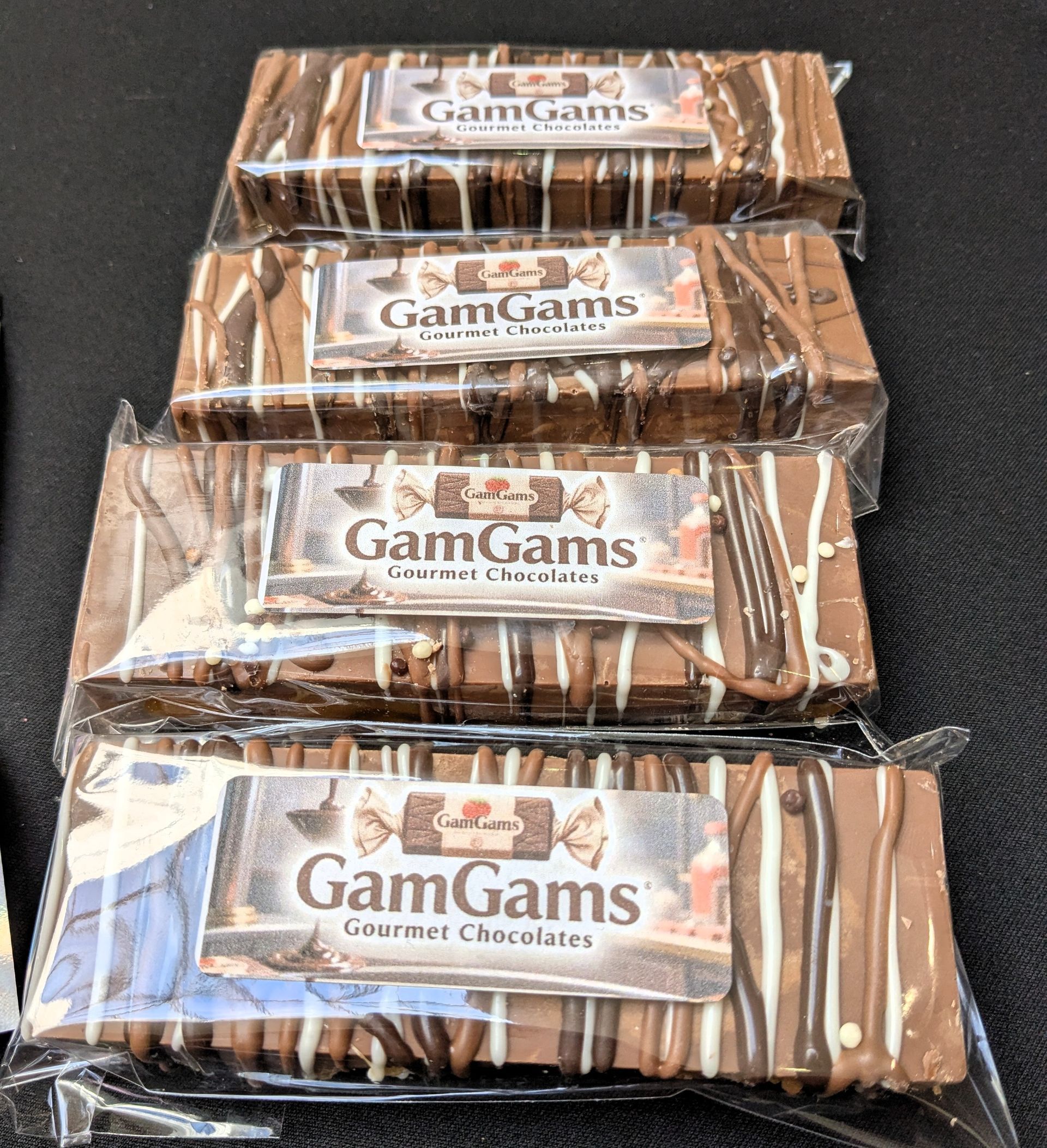 Four stacked GamGams chocolate wafer snack.