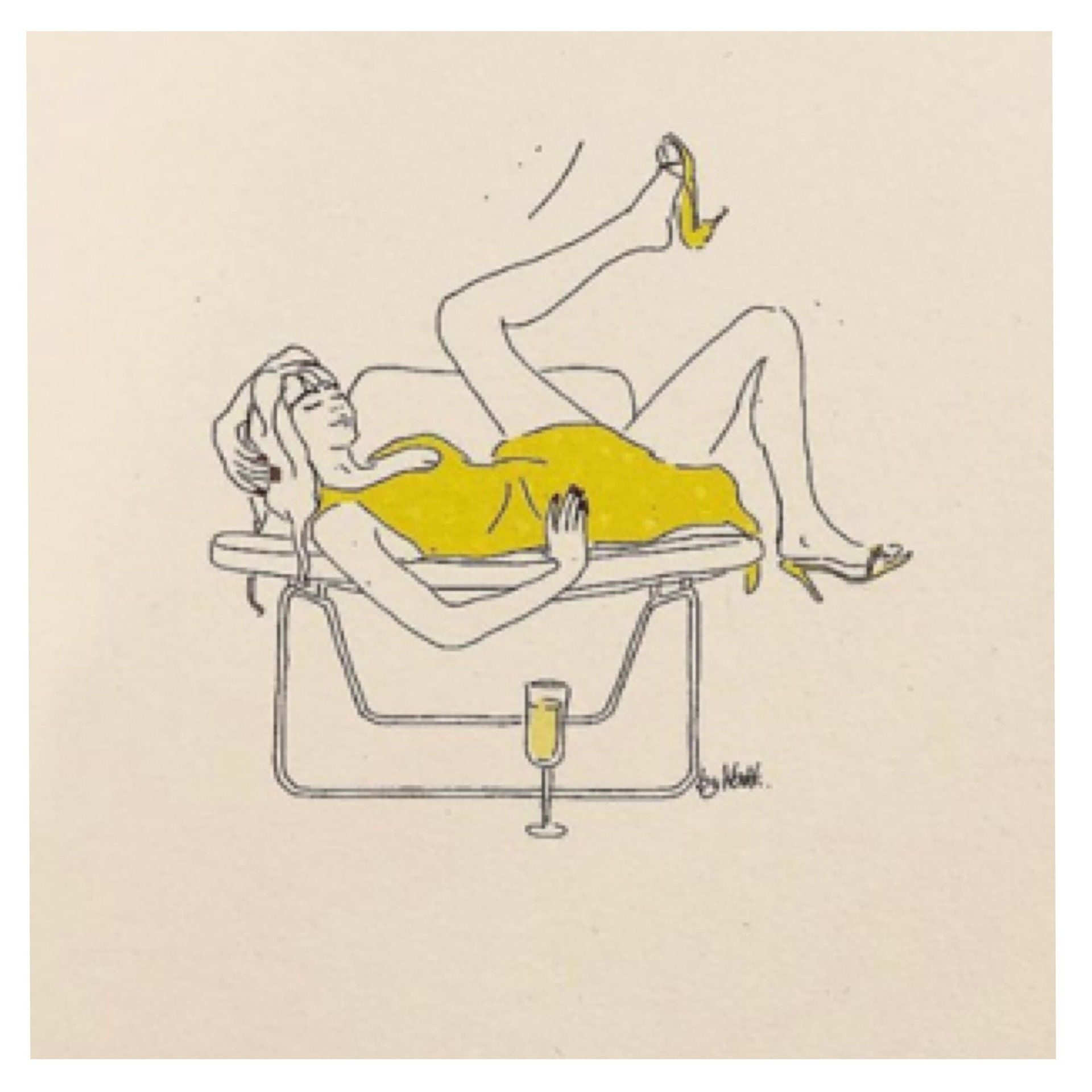 Woman reclining on a yellow towel on a chair, holding a champagne glass and lifting a leg with a yellow shoe.