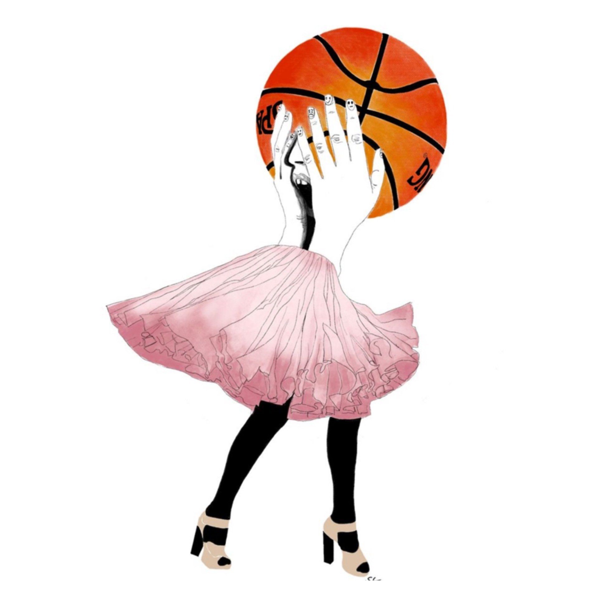 A person in a pink dress holding a basketball in front of their face.