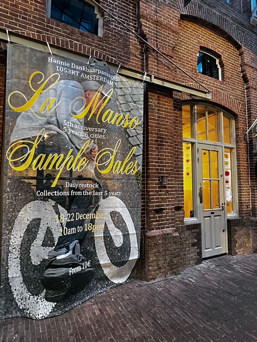 Poster on brick building: 