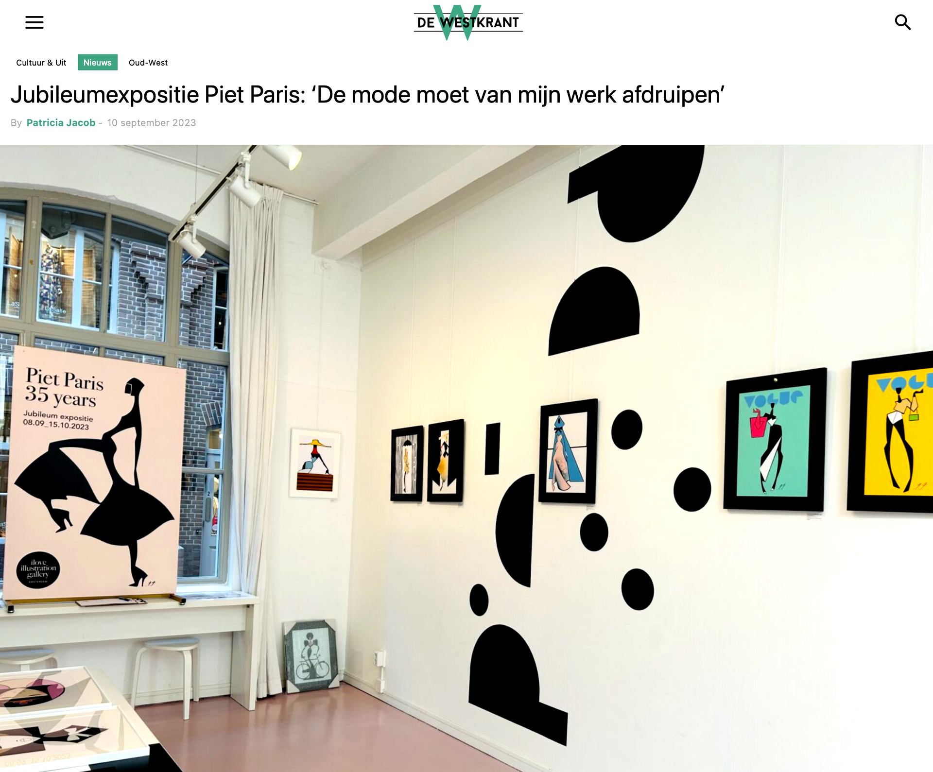 Art gallery interior with framed artwork and abstract black wall decals.