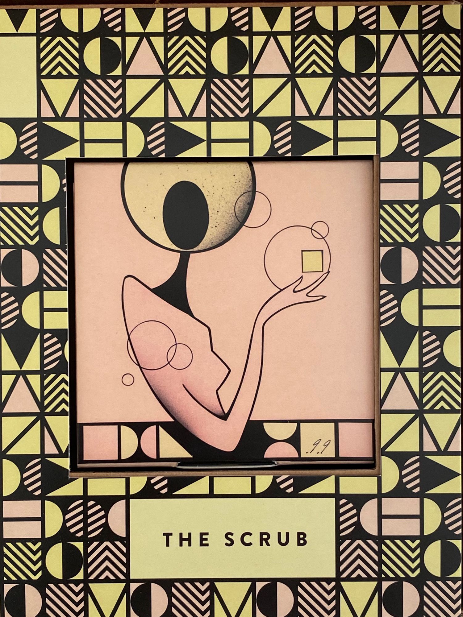 Box art: pale pink illustration of figure holding small cube; geometric frame in black, yellow, and pink.