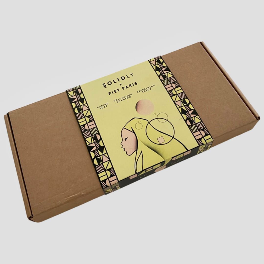 Brown cardboard box with yellow label; illustration of two people.