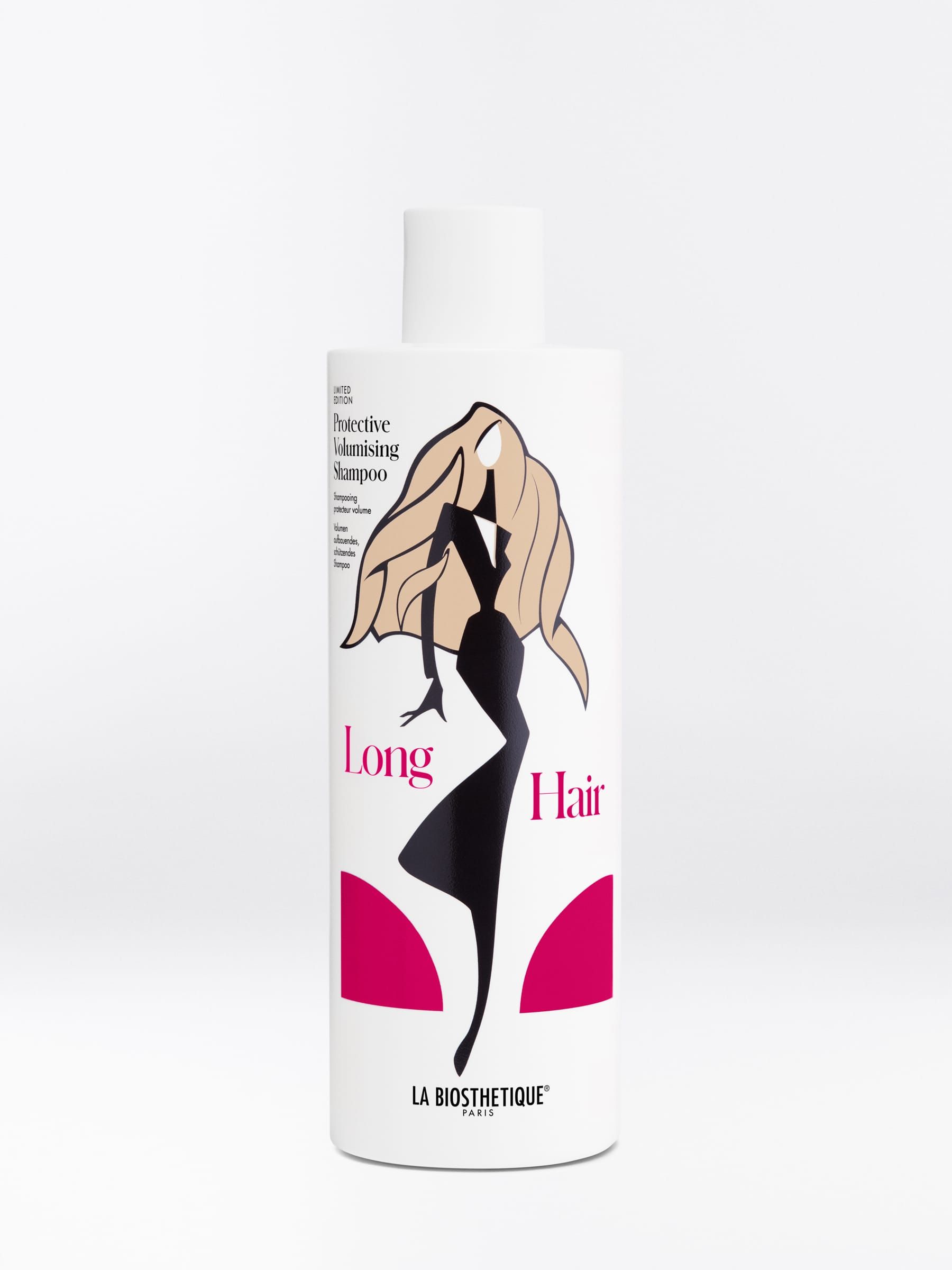 Bottle of hair product with illustration of woman with long hair in black dress.