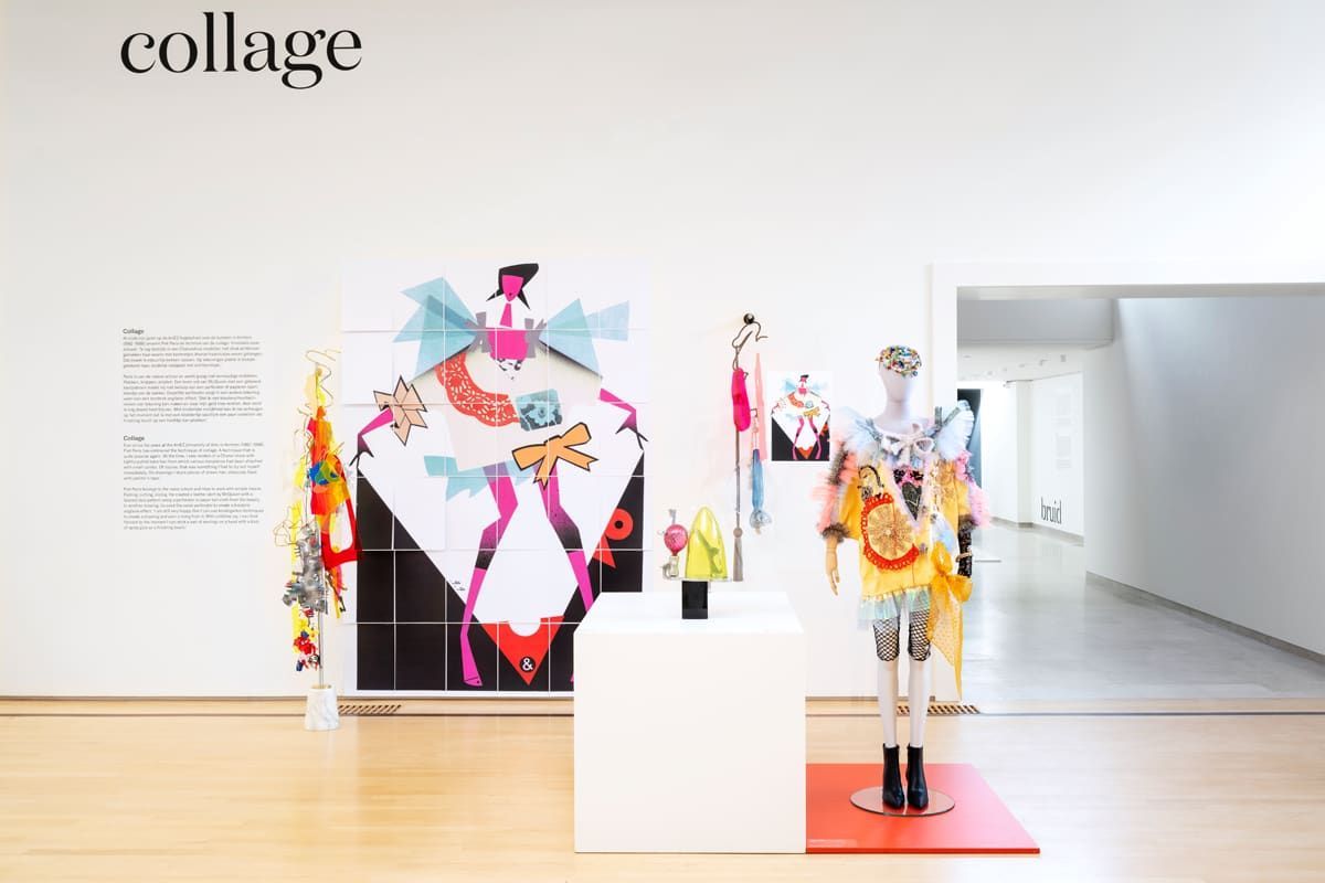 An art gallery displays colorful collages, one on a mannequin.