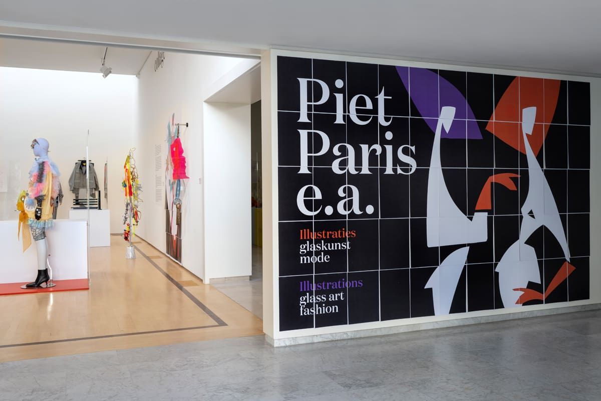 Interior museum view with a large poster on the wall: 