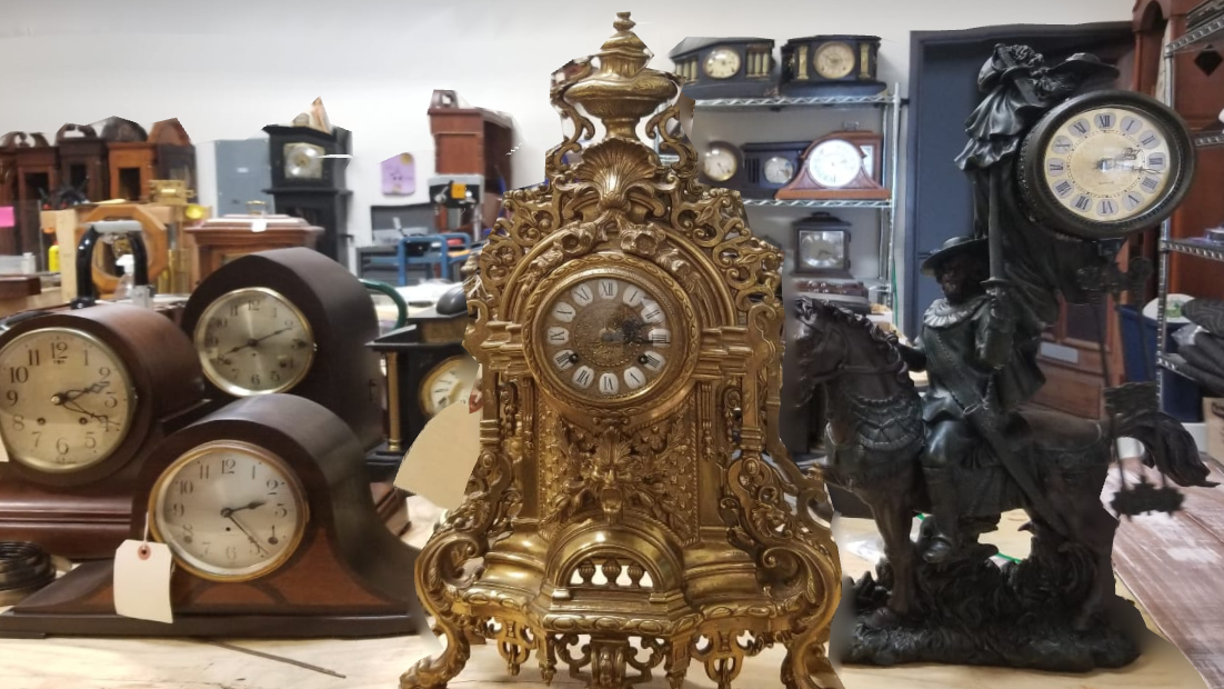 A group of clocks are sitting on a table in a room.
