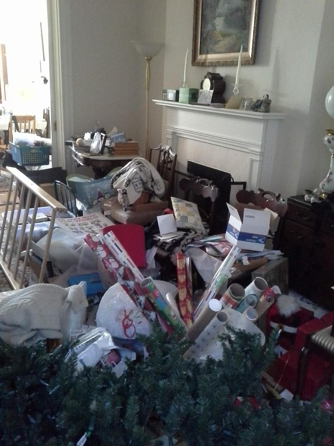 A living room filled with lots of christmas presents and a christmas tree.