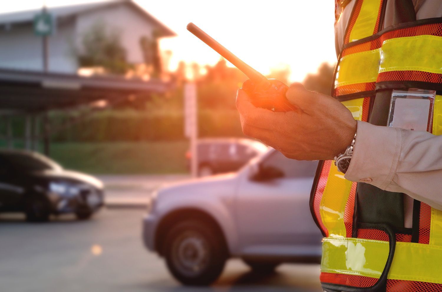 Security personnel holds a walkie-talkie
