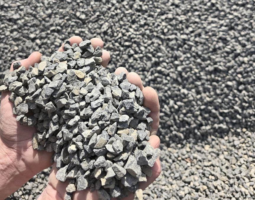 A Person Is Holding a Pile of Gravel in Their Hands — BVN Landscape and Concrete Supplies in Nowra, NSW