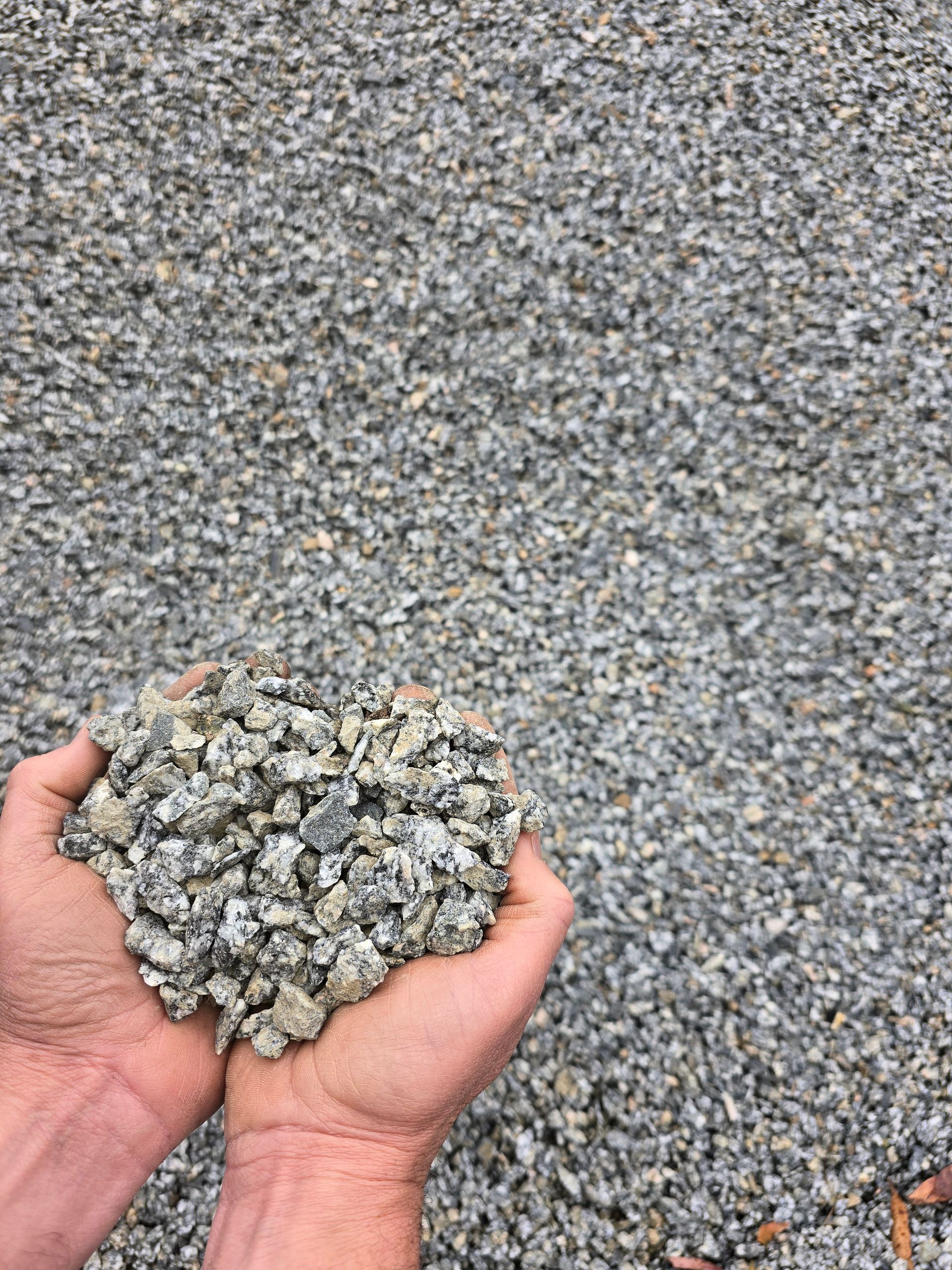 Hands Cupped, Holding a Pile of Small, Grey Gravel — BVN Landscape and Concrete Supplies in St Georges Basin, NSW