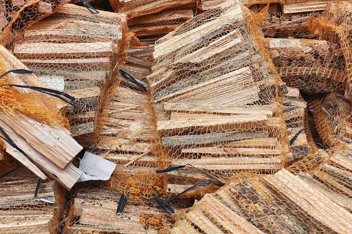 Stacks of Cut Firewood Piled Together — BVN Landscape and Concrete Supplies in Huskisson, NSW