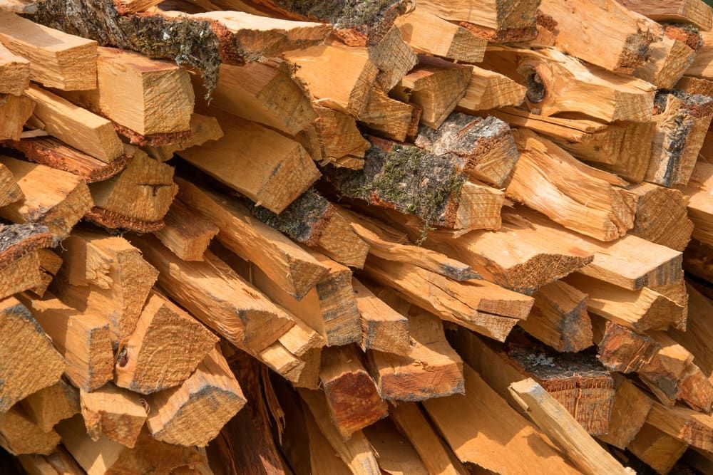 Stacked Chopped Firewood Logs in Warm Brown Tones — BVN Landscape and Concrete Supplies in Vincentia, NSW