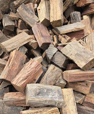 Pile of Weathered Firewood, Varying Colours of Brown and Grey — BVN Landscape and Concrete Supplies in St Georges Basin, NSW