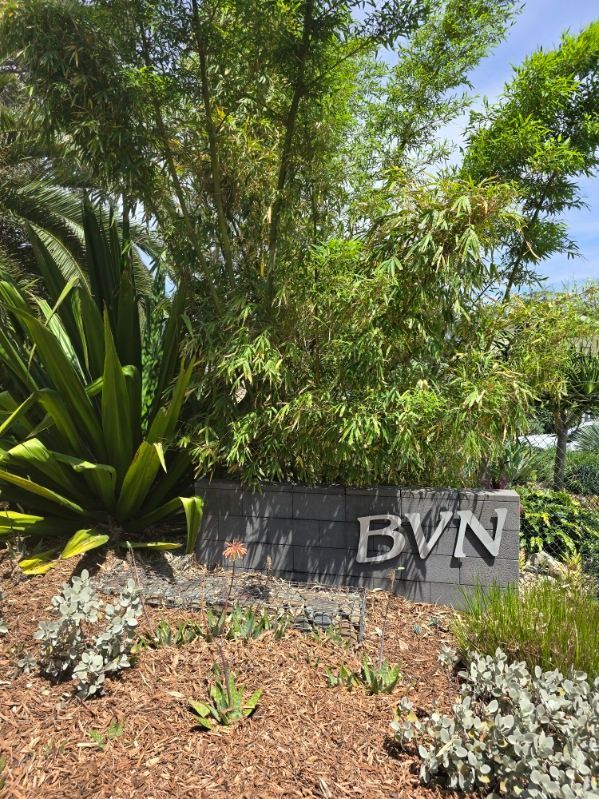 Sign for BVN Under Green Trees, With Plants and Mulch — BVN Landscape and Concrete Supplies in St Georges Basin, NSW