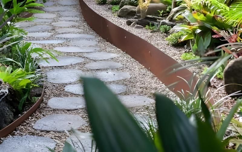 A Stone Stepping-stone Path Winds Through a Garden — BVN Landscape and Concrete Supplies in St Georges Basin, NSW