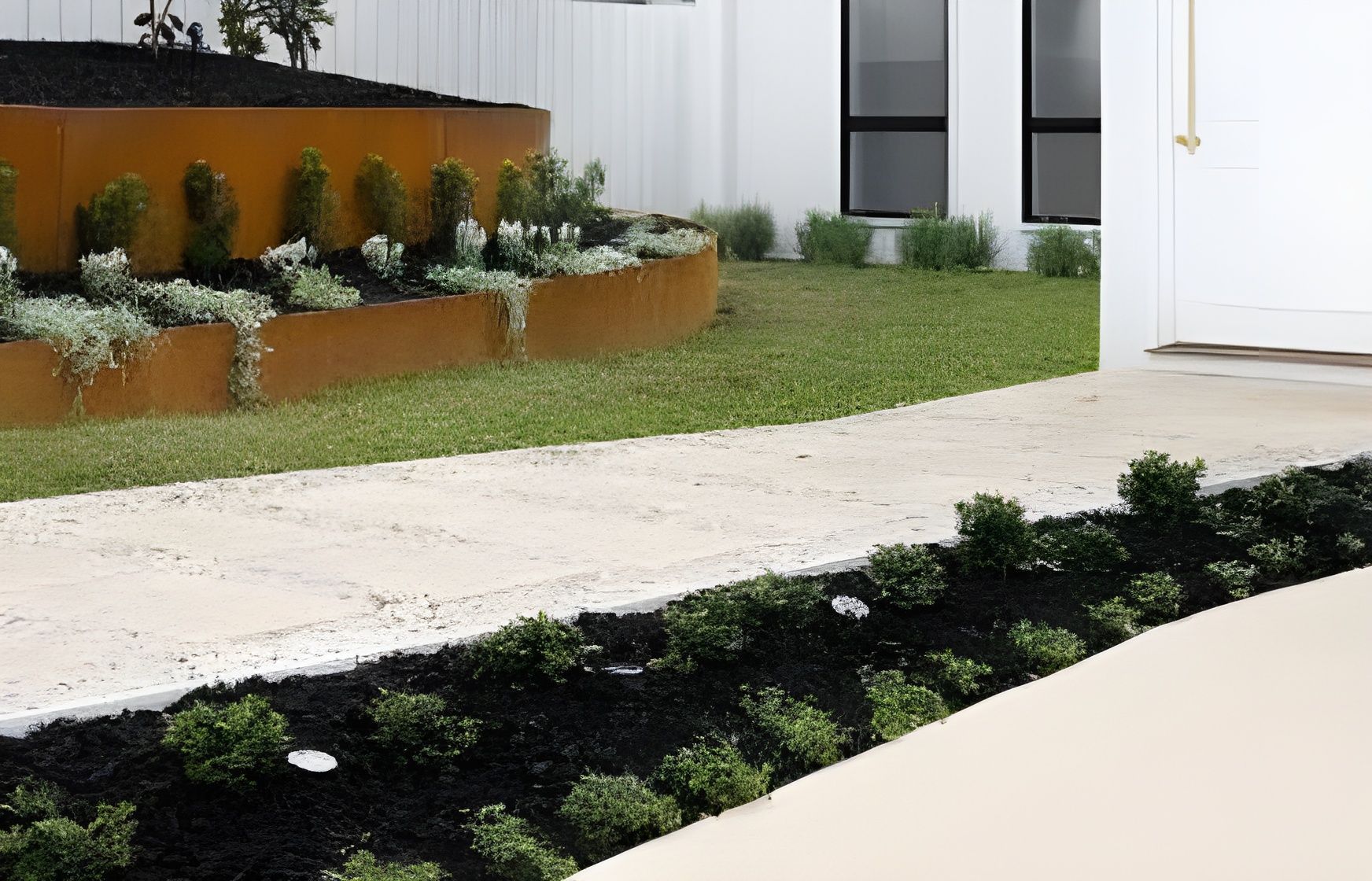 A Walkway Features a Rusted Metal Planter Bed on the Left — BVN Landscape and Concrete Supplies in St Georges Basin, NSW