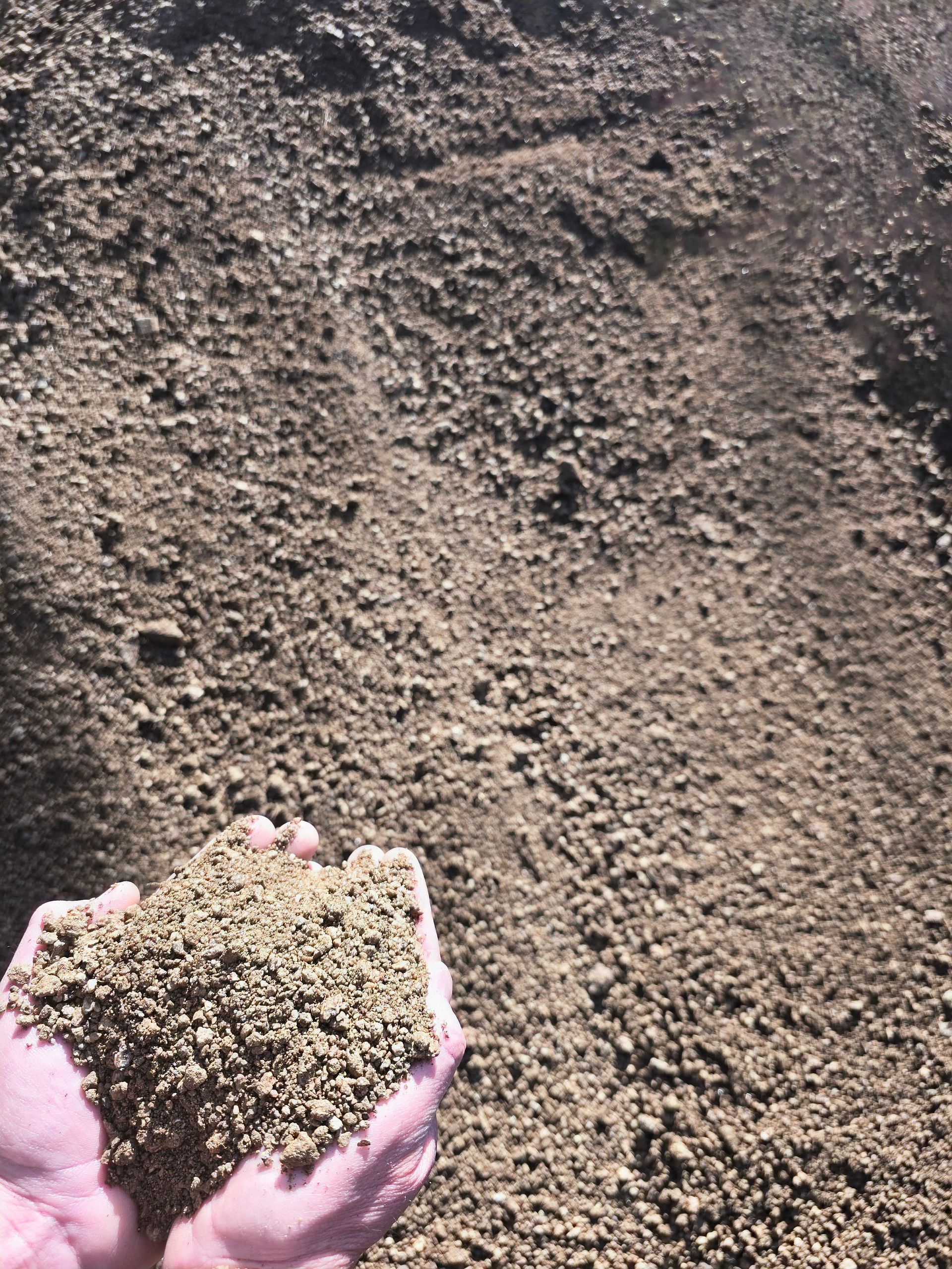 Handful of Tan-coloured Soil — BVN Landscape and Concrete Supplies in St Georges Basin, NSW