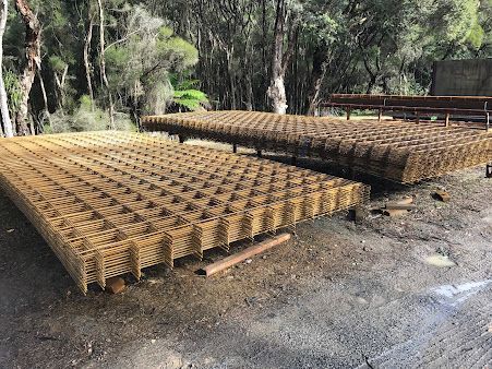 A Bunch of Metal Sheets Are Sitting on Top of Each Other on The Ground — BVN Landscape and Concrete Supplies in Nowra, NSW