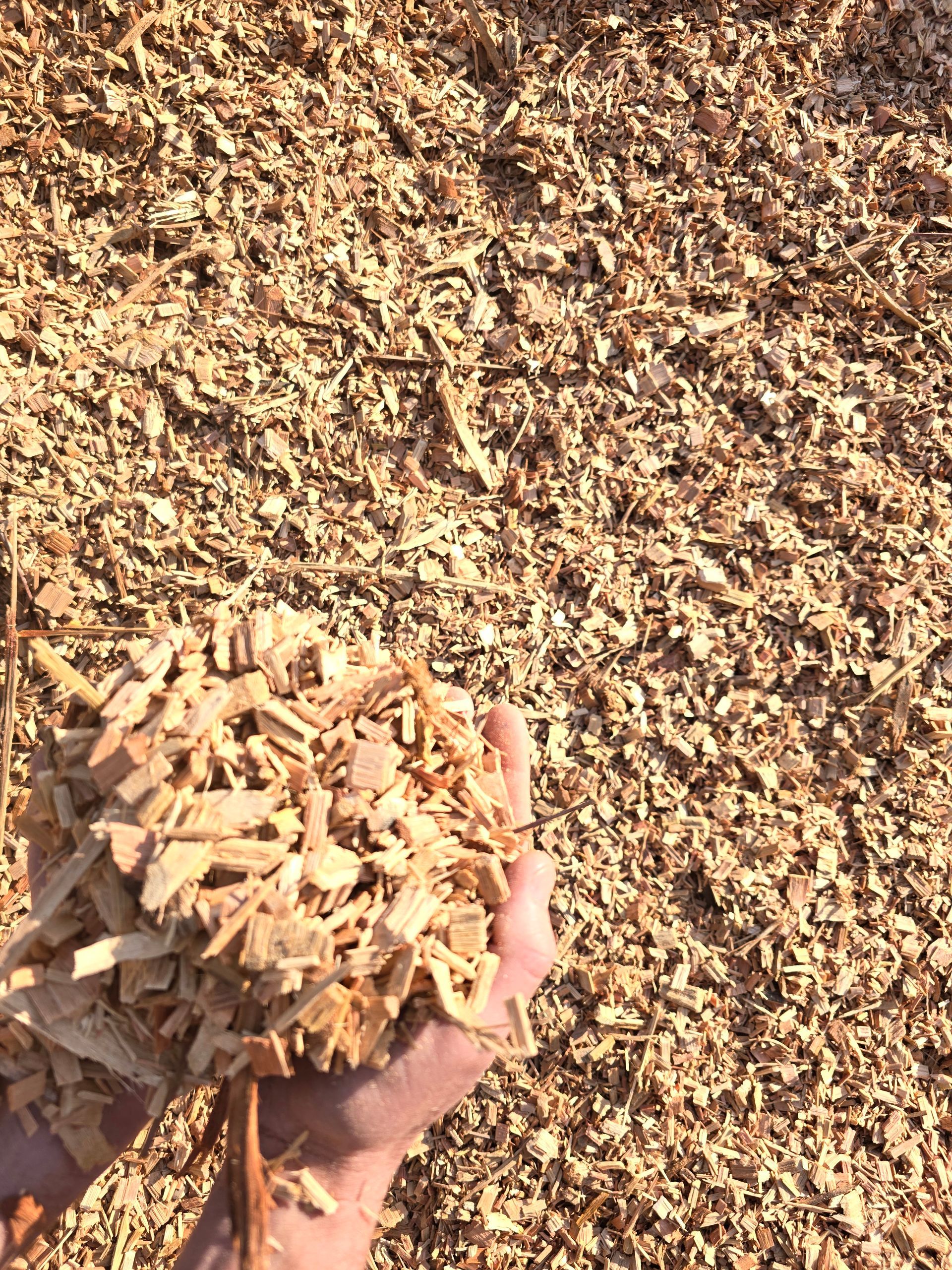 Handful of Light-coloured Mulch — BVN Landscape and Concrete Supplies in St Georges Basin, NSW