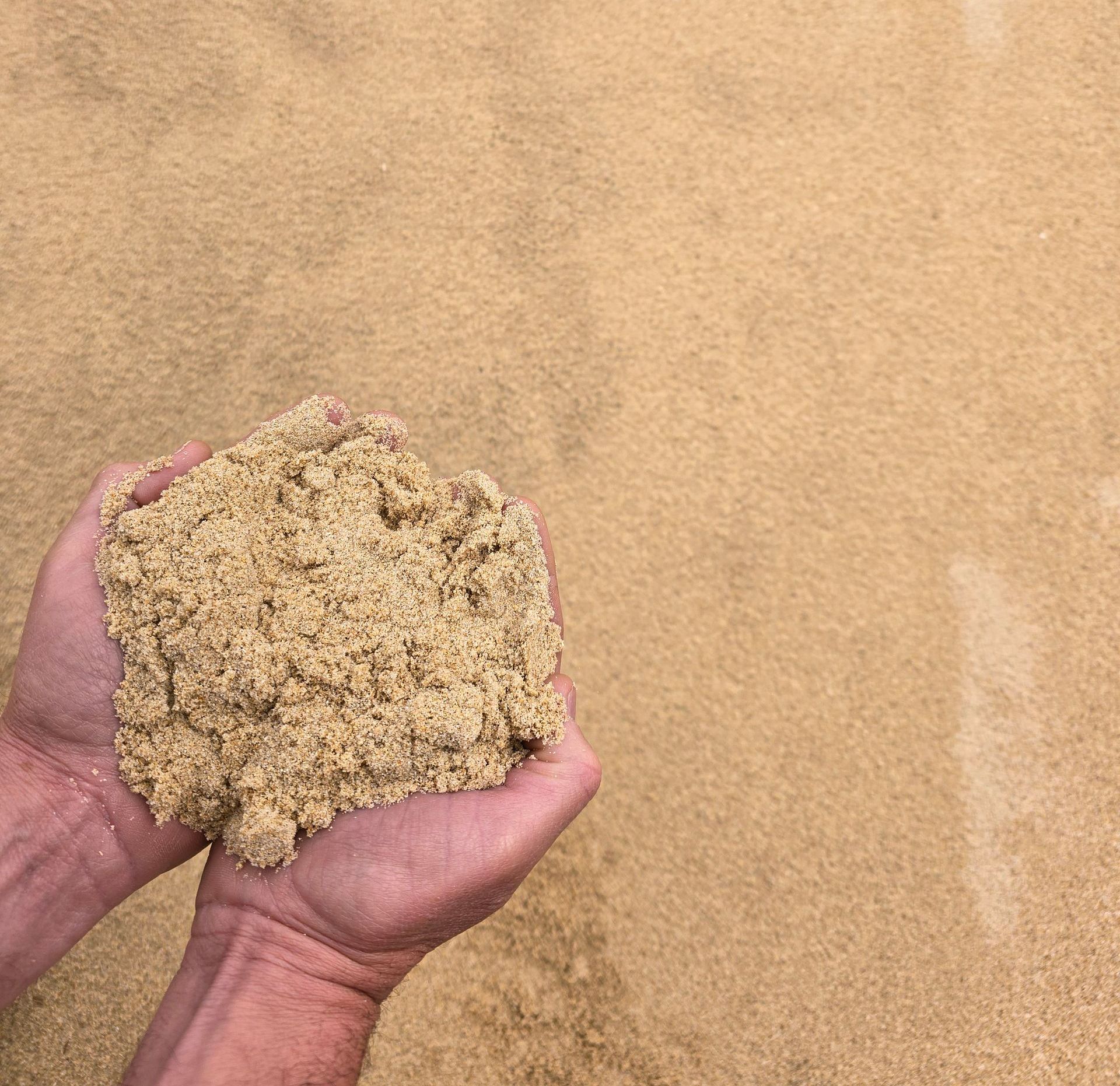 A Pile Of Sand In Someone's Hands — BVN Landscape and Concrete Supplies in St Georges Basin, NSW