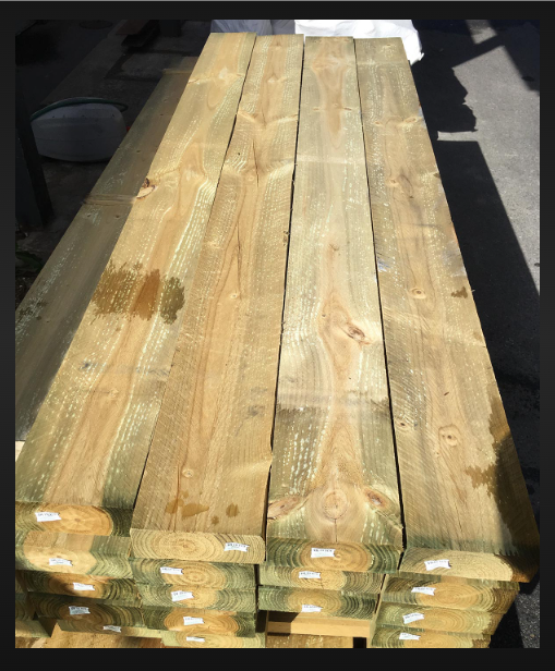 A Pile Of Treated Pine Stacked Together — BVN Landscape and Concrete Supplies in St Georges Basin, NSW