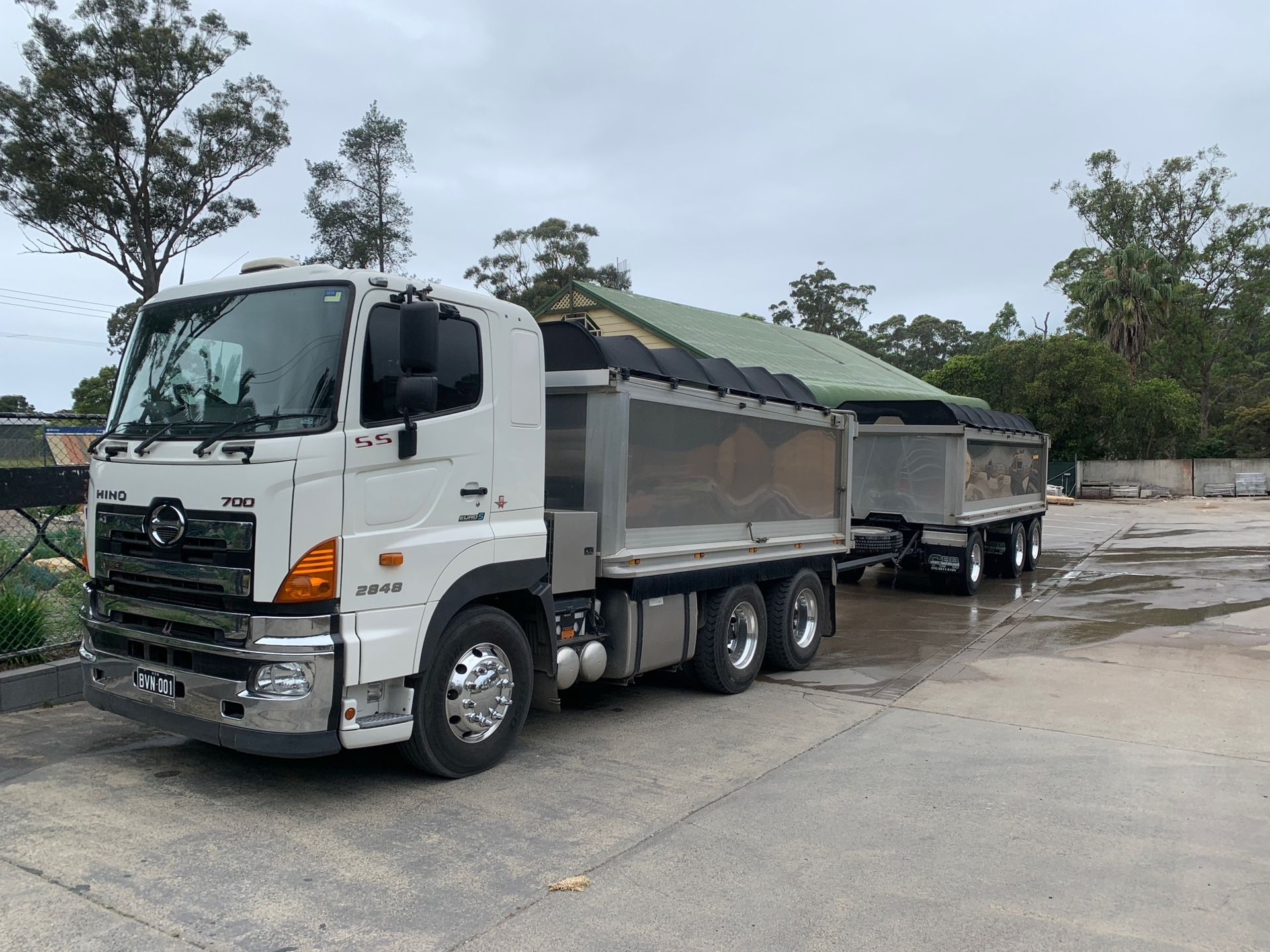 White Dump Truck With Trailer, Parked on Pavement — BVN Landscape and Concrete Supplies in St Georges Basin, NSW