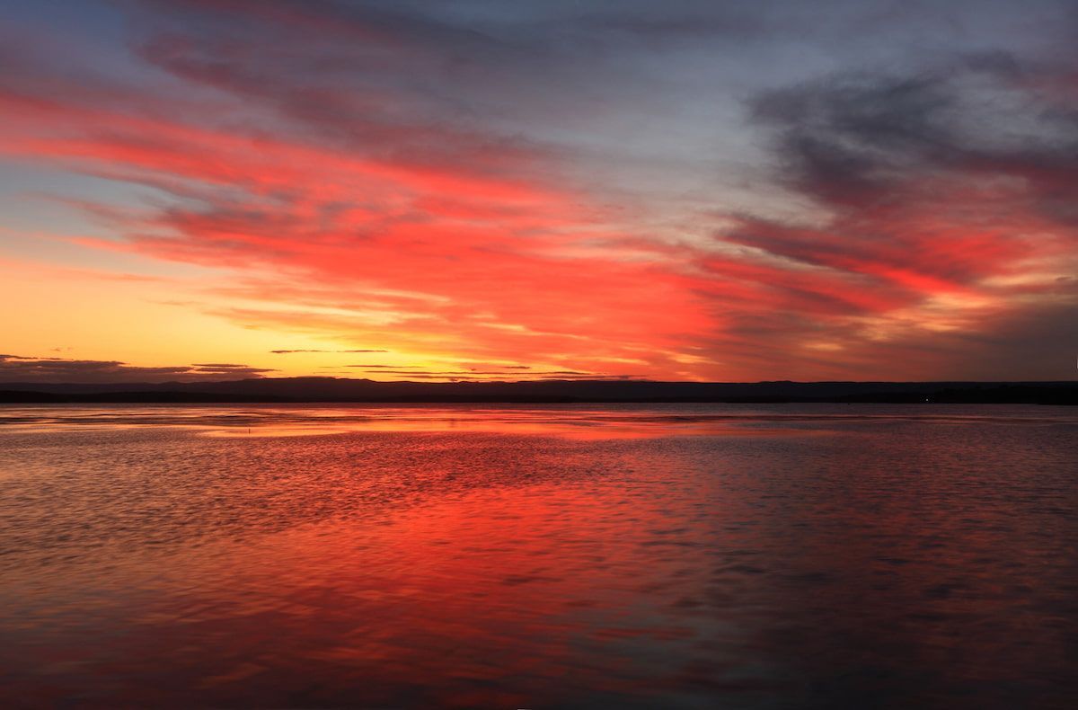 Sunset Over a Calm Body of Water — BVN Landscape and Concrete Supplies in St Georges Basin, NSW