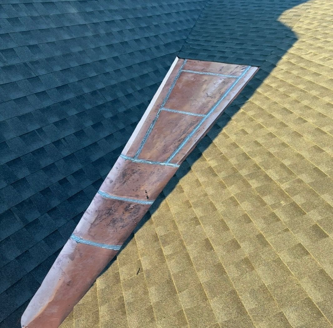 A piece of wood is sitting on top of a roof