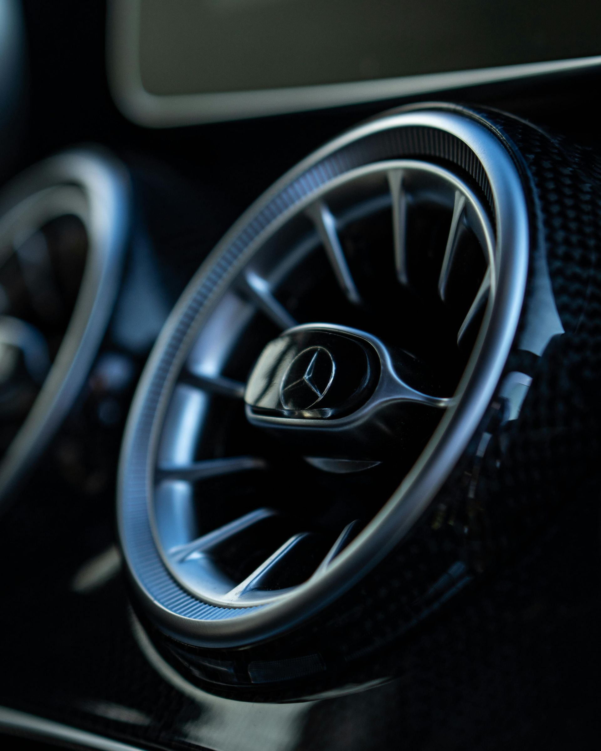 A close up of a car air vent with a mercedes logo on it — SMK Rural & Mechanical Pty Ltd in Rockhampton City, QLD