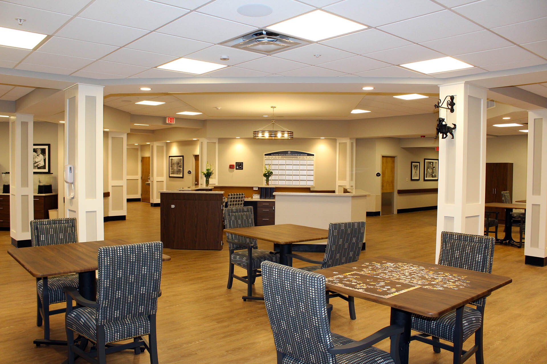 A large room with tables and chairs in it