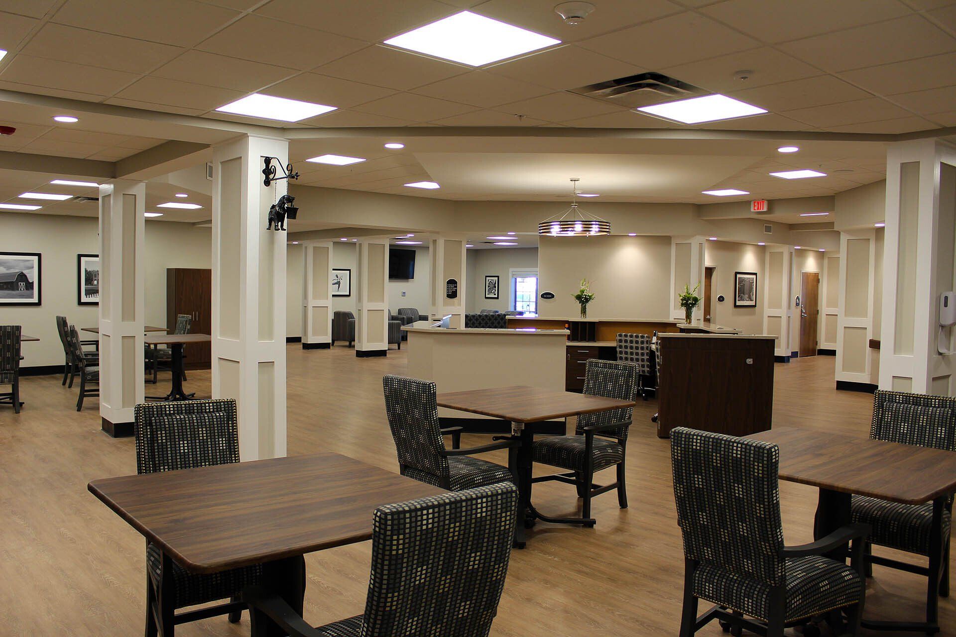 A large room with tables and chairs in it