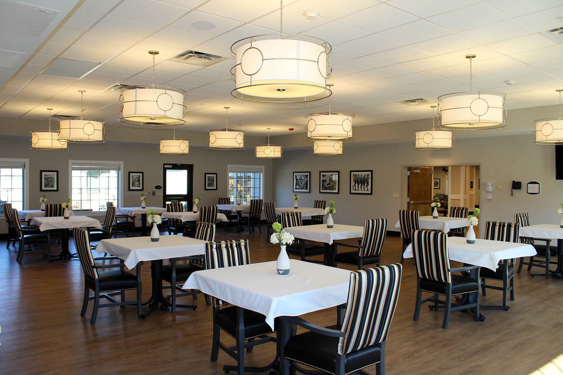 A large room with tables and chairs in it