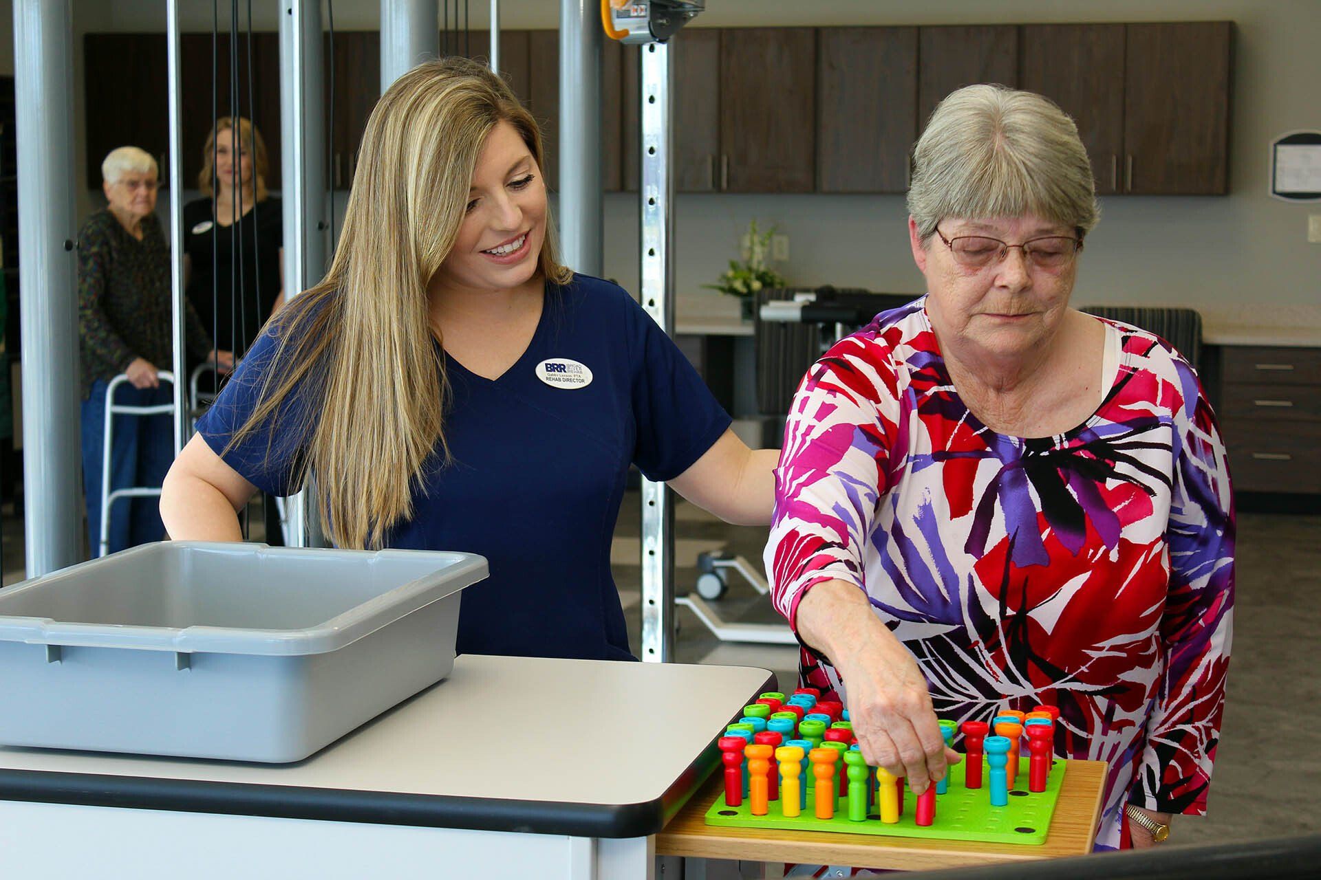 A woman is helping an older woman with a puzzle.