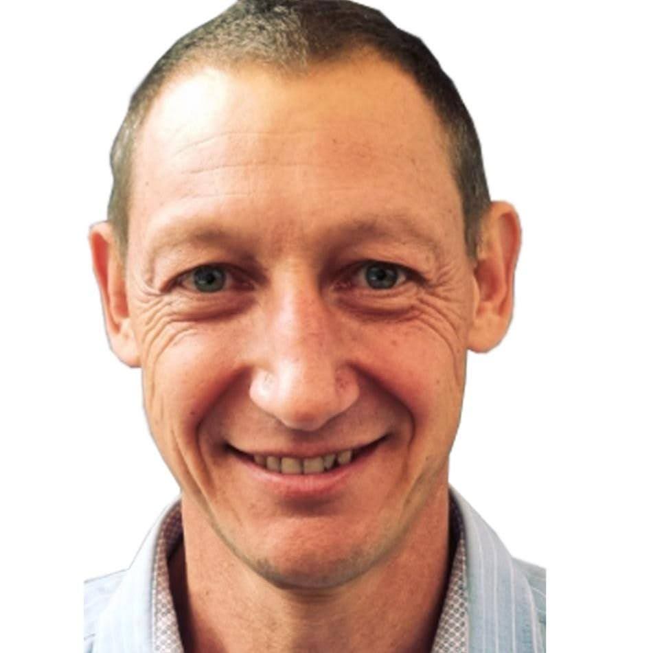 A close up of a man 's face with a white background