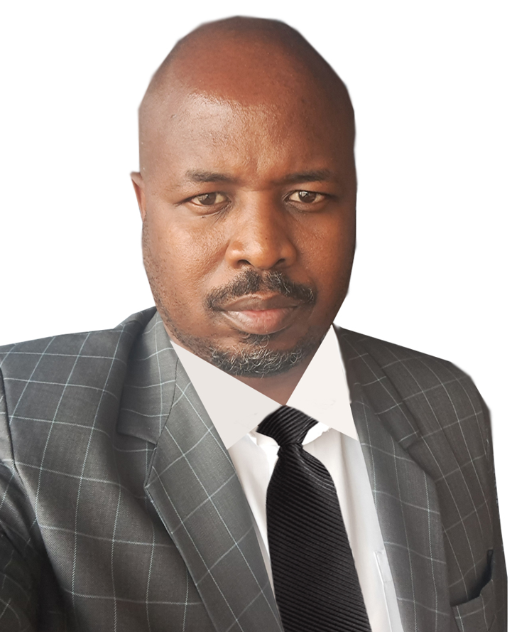 A man in a suit and tie is looking at the camera.