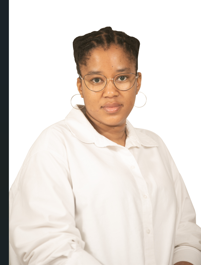 A woman wearing glasses and a white shirt is standing in front of a white background.