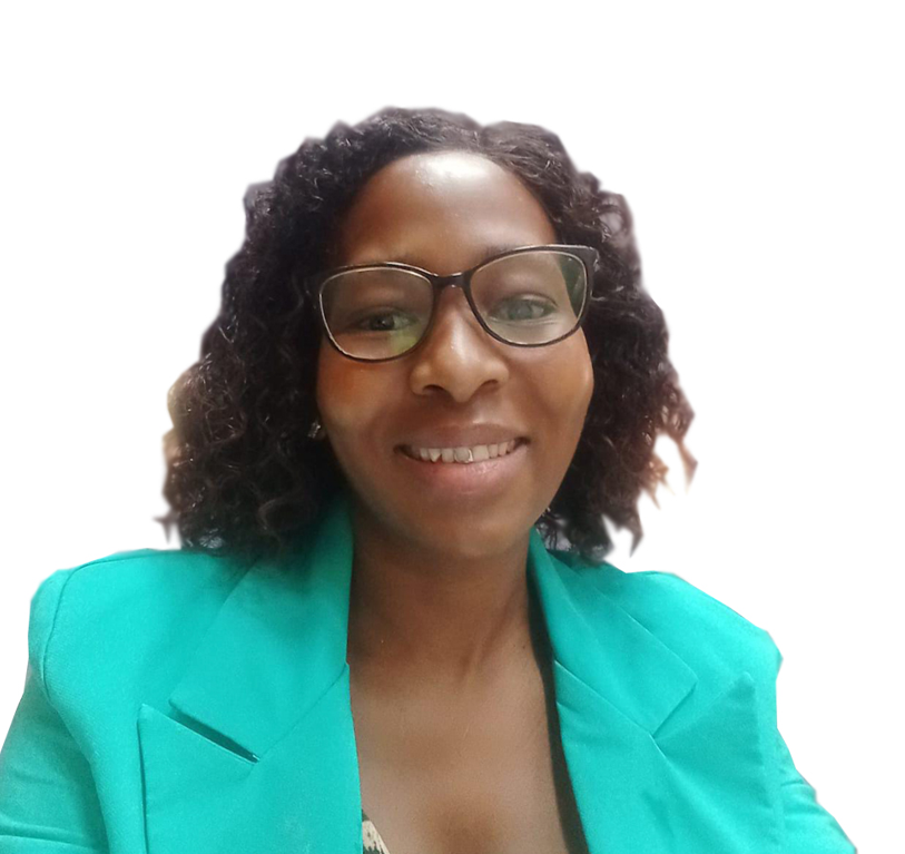 A woman wearing glasses and a green jacket smiles for the camera